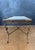Elegant neoclassical style coffee table featuring a marble top and a finely crafted gilt metal structure. The table stands...