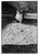 Black and white photo of a cat on a gravel road by Peter McArthur (American, b. 1947). In the top portion of the...