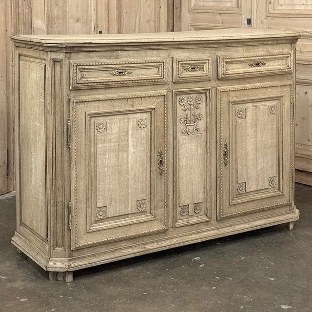 18th Century French Louis XVI Period Buffet in Stripped Oak is a timeless example of rural artisans emulating the styles...