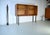 This is a Danish bookcase from the 1960s. The bookcase features a high-quality teak veneer with rounded corners. Both...