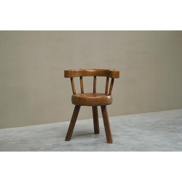 A sculptural three-legged provincial vernacular chair. France, late 19th to early 20th century. A rare and characterful...