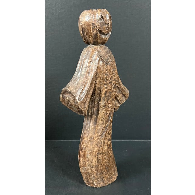 ITEM NAME: Folk Art Carved Wooden Jack o Lantern Ghost Statue ORIGIN: Philippines AGES: Late 20th Century MATERIALS: Wood...