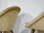 Two shell lounge chairs in the style of Jean Royère, 1950s. Organic design with a wraparound upholstered shell, loose seat...