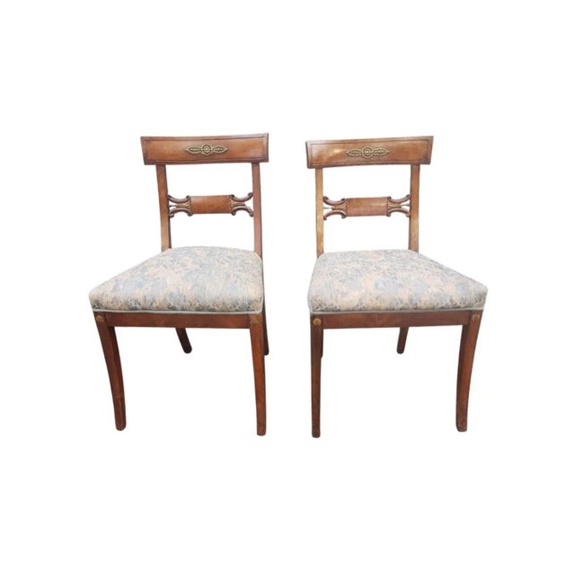 Pair of 19th Century Empire Ormolu Mounted, Partial Gilt Mahogany & Upholstered side Chairs. Measure 19" in width, 19" in...
