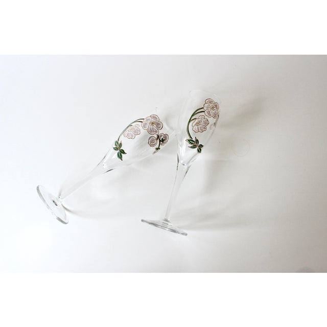 Pair of vintage Perrier Jouet champagne flutes for toasting. Pink and white flowers with green leaves outlined in gold...