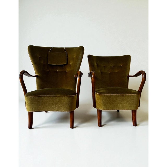 This elegant pair of Danish lounge chairs is attributed to Alfred Christensen and dates to the mid-20th century. The...