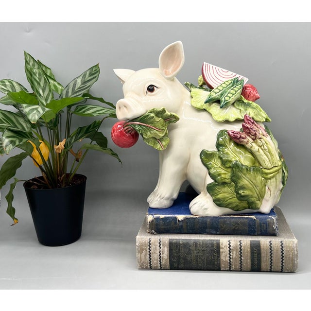 Stunning lidded jar from the Fitz & Floyd French Market collection featuring an adorable pig carrying fresh market...