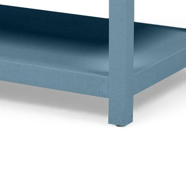 Custom modern style coffee table wrapped in raffia. The name of this paint is "Reflection of the Sea." This is a modern...