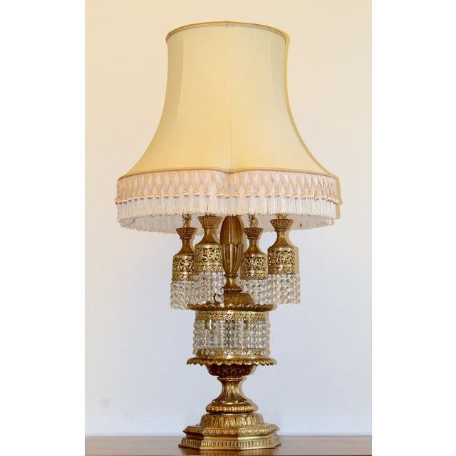 Bring unparalleled mid-century glamour to your space with this show-stopping Hollywood Regency waterfall table lamp....