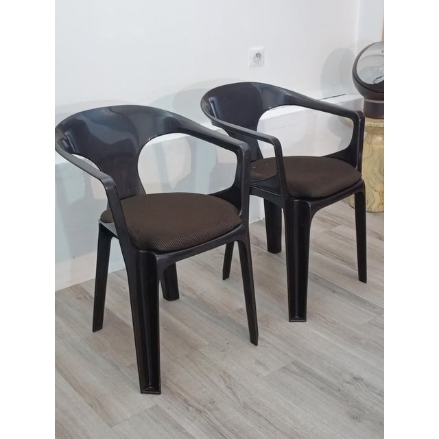 A beautiful pair of armchairs by Henry Massonnet for Stamp. France, 1974. Very rare model with velvet seats. Stackable....