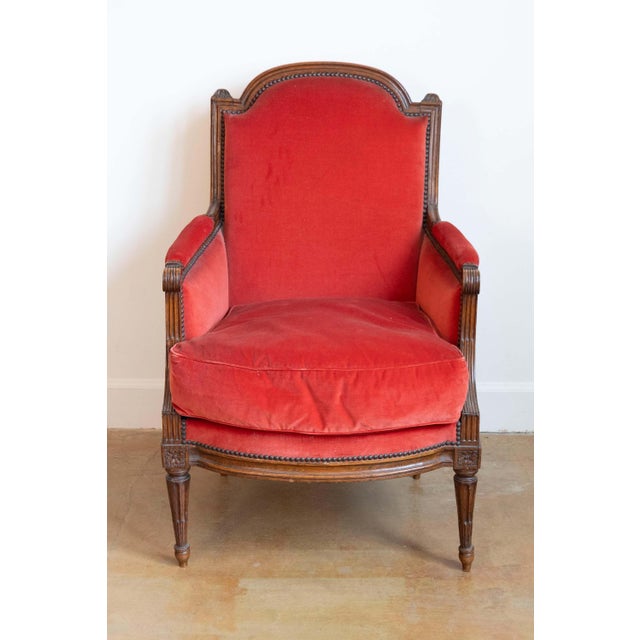 This exquisite 18th-century French Louis XVI bergère embodies the refined elegance and craftsmanship of the period....