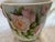 An antique franc porcelain footed cachepot probably from Limoges. The piece features hand painted pink and peach roses on...