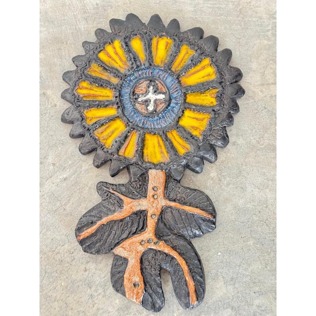 This striking mid-century modern ceramic wall sculpture is a highly collectible work of art designed by renowned Belgian...