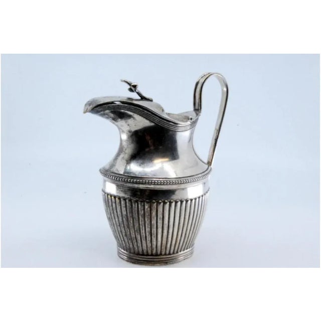 Fluted Silver Milk Jug, in Very Good conditions. Designed before 1890 This piece has an attribution mark, I am sure that...