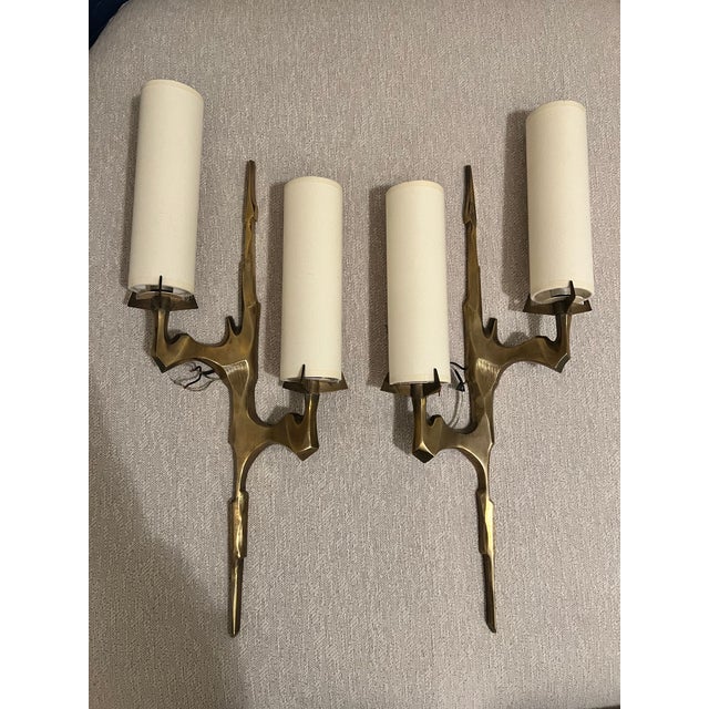 Pair of sconces or wall lights by Maison Arlus based on Felix Agostini drawing for manufacture. In cast gilt bronze, very...
