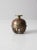 This antique Indian elephant claw bell is a distinctive decorative object that reflects traditional craftsmanship. The...