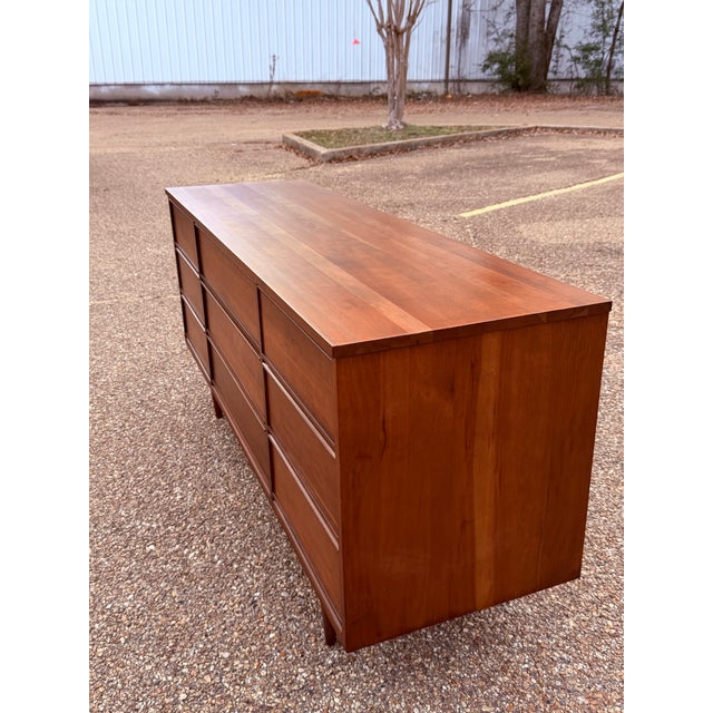 Embodying the clean lines and timeless elegance of 1960s design, this vintage Dixie lowboy dresser is a standout example...