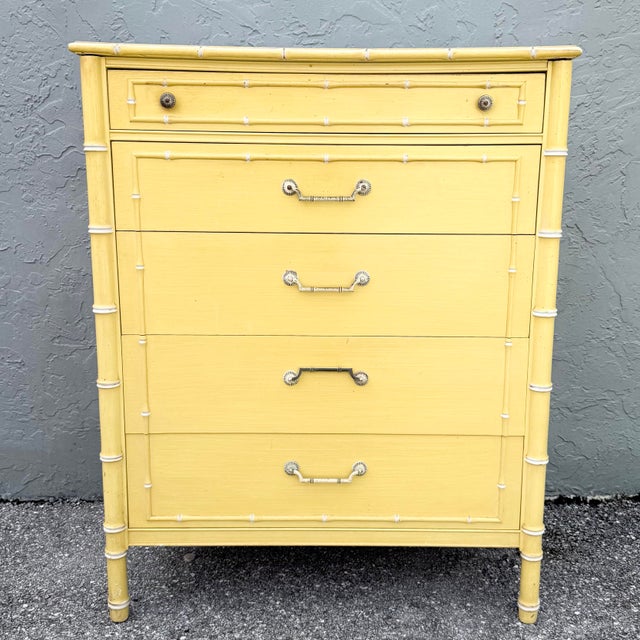This vintage coastal highboy dresser by Thomasville brings sunny Palm Beach character to a practical vertical silhouette....