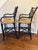 A fabulous pair of Hollywood Regency–style Chinoiserie barstools featuring glossy black lacquered bamboo frames,...