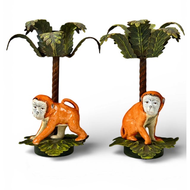 Whimsical and finely crafted, this pair of hand-painted porcelain monkey and tole palm candlesticks is attributed to...