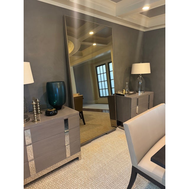 Add depth and drama to your living space with this oversized standing floor-length mirror. Custom-made (through Anthem...