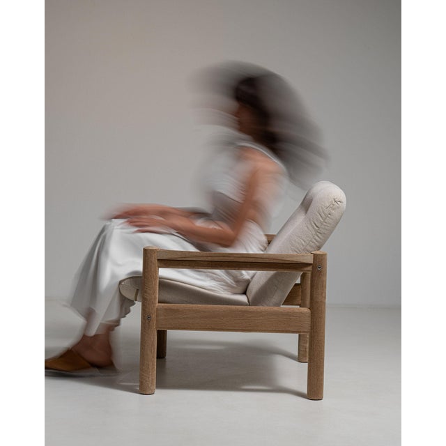 This bench carries genuine presence, its whitewashed wood, cream upholstered cushion top immediately setting the tone for...