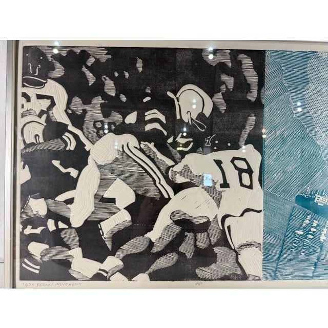 This powerful and thought-provoking framed block print titled "60s Redux / Movement" was hand-pulled by Herbert Simon in...