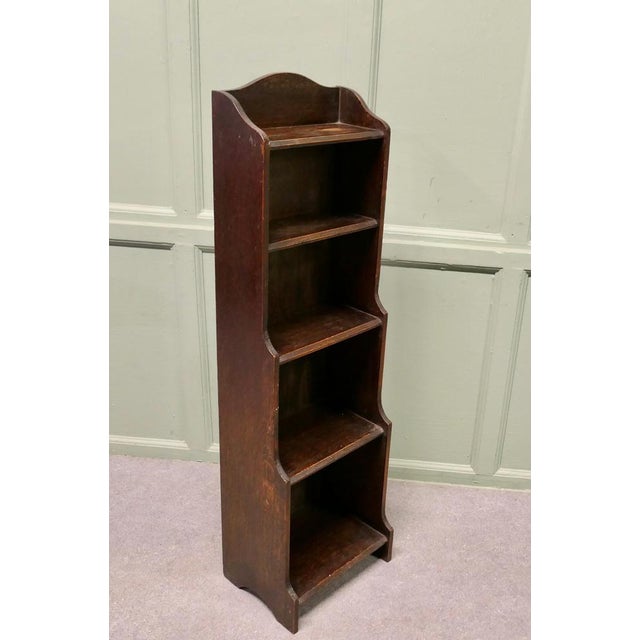 Art Deco Tall Slim Golden Oak Bookcase. This Oak bookcase has a slight waterfall shape at the lower half and 5 open...