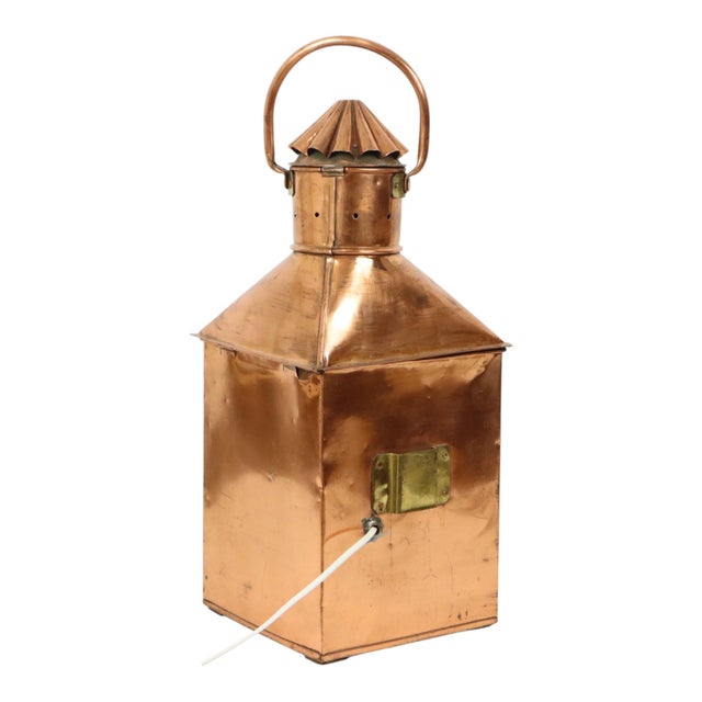 Large vintage ship's lamp made of red copper and brass; the lamp features a removable red filter that can be placed behind...
