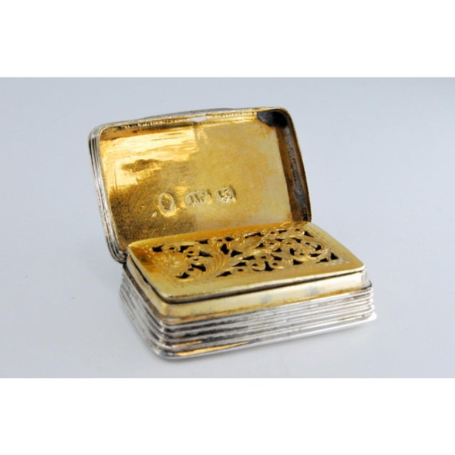 William IV Silver and Gold Vinaigrette Box with Engravings, in Very Good conditions. Designed before 1890 This piece has...