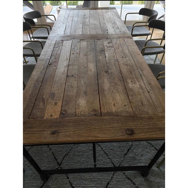 Extra long vintage solid elm wood table with heavy cast iron legs. Extremely heavy. Superior craftsmanship. Perfect for...