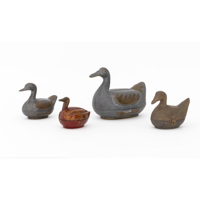 Group of Four Chinese Duck Form Covered Boxes, comprising: (1) one painted papier mache with figural motif to the lid, (2)...