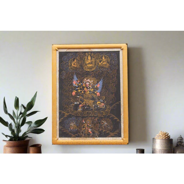 This antique thangka painting invites you to explore the mystical world of Tibetan Buddhism. Likely dating back to the...