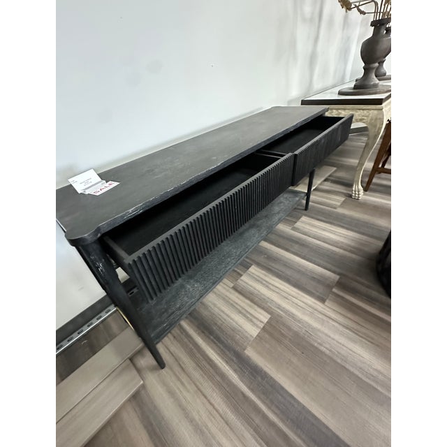 The Bliss Galileo Console Table is a striking balance of sculptural form and refined craftsmanship. Defined by its clean...