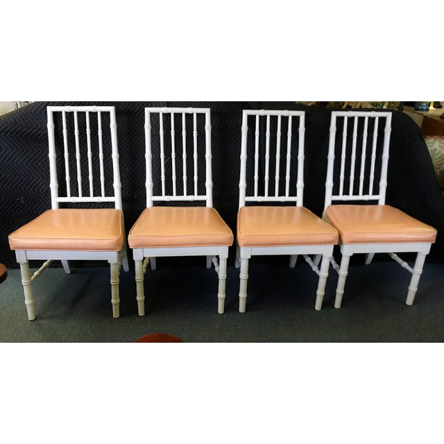 Very nice! These faux bamboo chairs are timeless and very sturdy. They have white painted frames, and a melon colored...