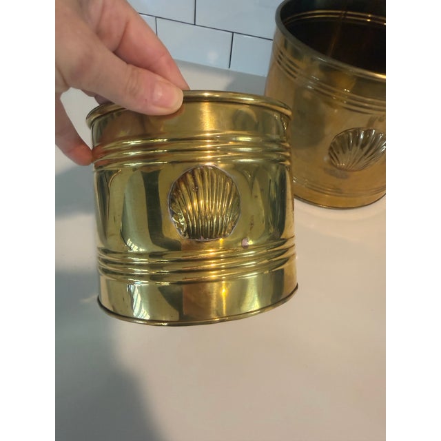 This vintage brass planter set features embossed clam shell accents. They are made of brass with potential for patina over...