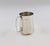 Silver jug is a precious decorative object realized in 20th century. Very precious little silver jug with handle. In good...