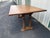 A unique and beautiful rustic oak tavern style dining table. The 6’ long tabletop slides via wooden tracks on the table...