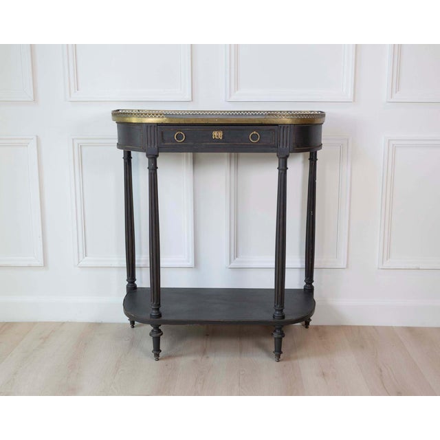 Crafted in Sweden around 1850, this elegant mid-19th century console table reflects the restrained neoclassical influence...