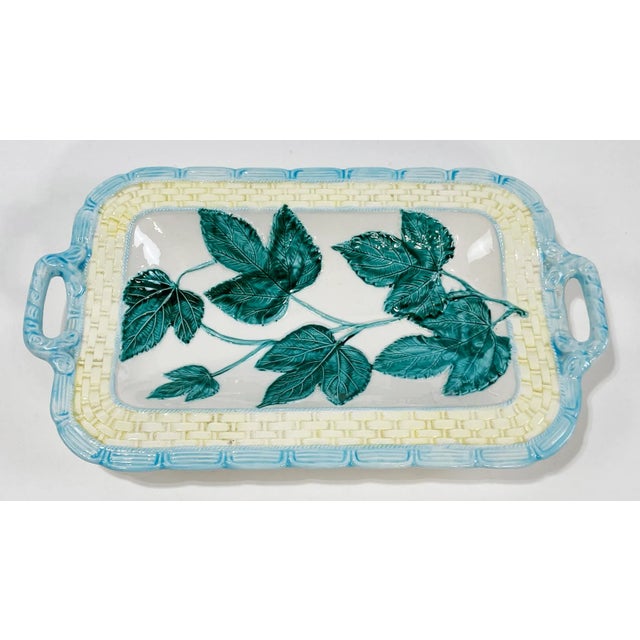 Vintage Majolica style ceramic bread tray or bowl featuring lovely spring palette with ivy and basket design. Made by The...