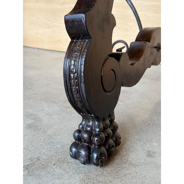 19th century Spanish trestle table in walnut. This piece has a great scale, lovely carved lyre legs and beautiful ebonized...