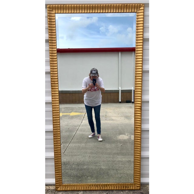 Beautiful large ornate beveled glass full length mirror.. Beautiful ornate gold wood frame. Ready to hang. Beveled mirror....