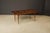 A circa 1950s Tommi Parzinger for Charak Modern extendable dining table crafted with contrasting Mahogany and geometric...