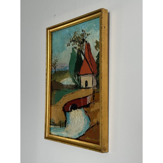 This is a sweet little village landscape on board in its original gold frame. Signed “John Combs” (?) in the lower right...
