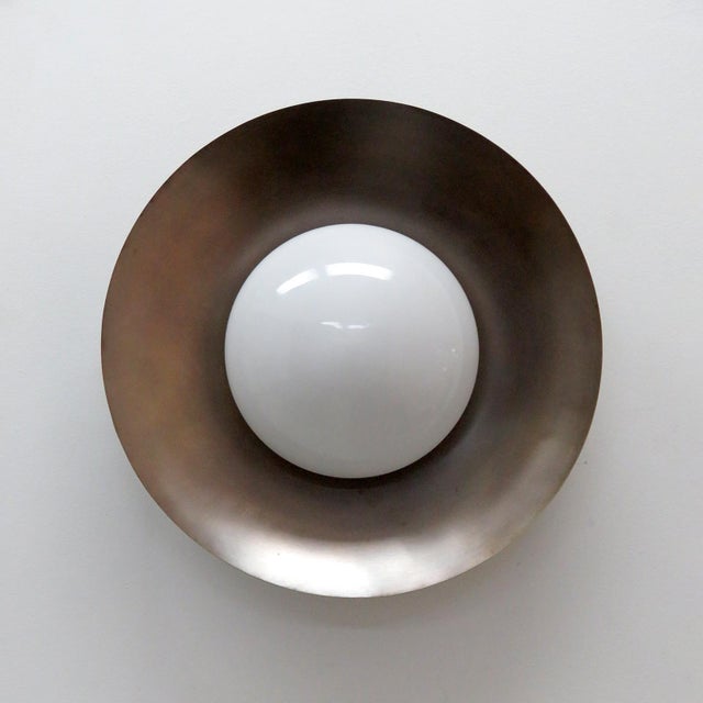 Elegant Iowa flush mount light designed by Gallery L7, handcrafted and finished in Los Angeles from American brass, with...