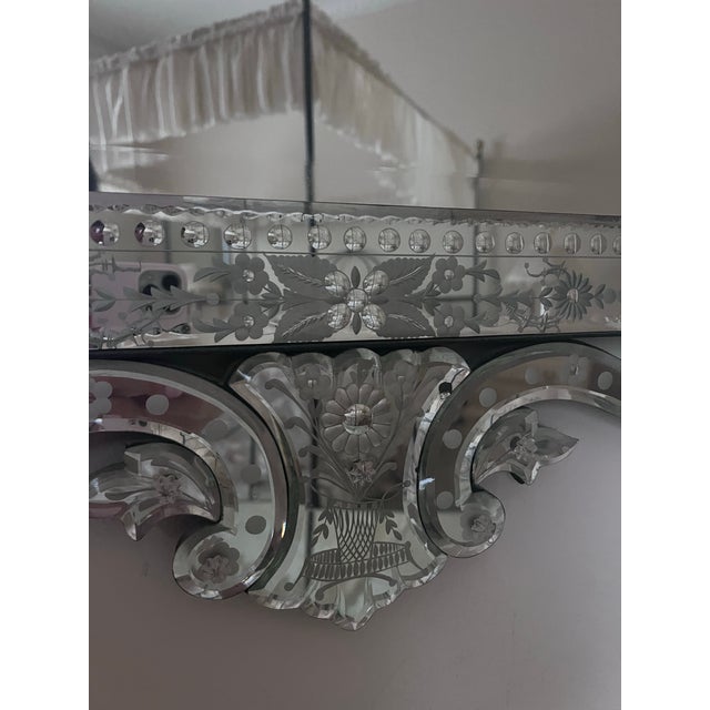 This exquisite Venetian etched glass wall mirror is a stunning example of Italian craftsmanship. It features a large...