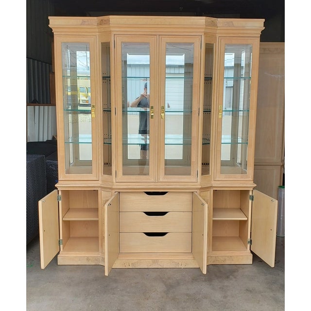 This beautiful China and silverware cabinet is made of solid oak and burled ash wood. It measures 70"W x 16"D x 83" tall....