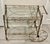 This ornate Hollywood Regency brass bar cart is a showstopper — a glamorous mid‑century treasure that instantly elevates...