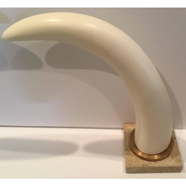Elagent pair of Tusk horn, made of resin, mounted on brass and coral stone. Base size 6"x6" X 1