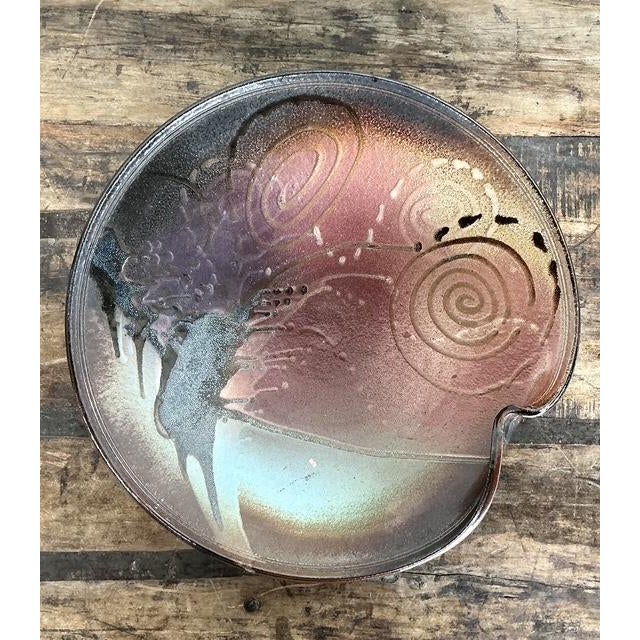 This striking vintage studio pottery charger is a masterpiece of ceramic art, perfectly blending organic form with...